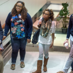 Long and Students on Staircase