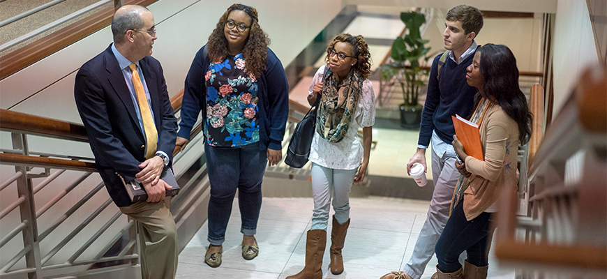Long and Students on Staircase