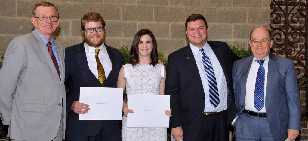 Professor and National Moot Court coach Joe Cook (far right) stands with (from left) co-coach and professor John Sobieski and 2014–2015 National Moot Court Team members John Baxter (’16), Kaitlyn Holland (’16), and Jarrod Casteel (’16). Under Cook and Sobieski’s guidance, the 2014–2015 team competed in the National Moot Court finals and won the award for best brief.